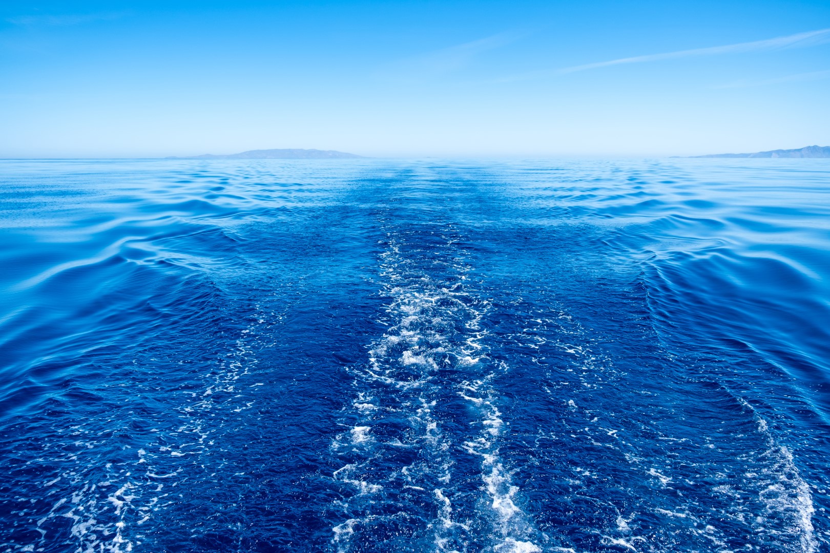 Blue wake. Blue Sea White Boat.